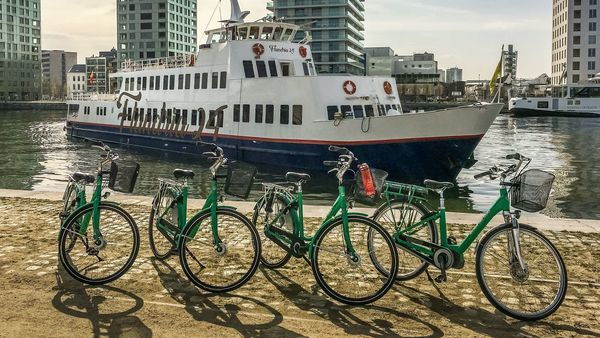 Bicycles are ready on shore for the boat trip participants