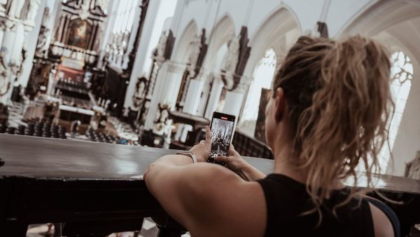St Paul's Church, lady photographs the beauty of the church with her phone