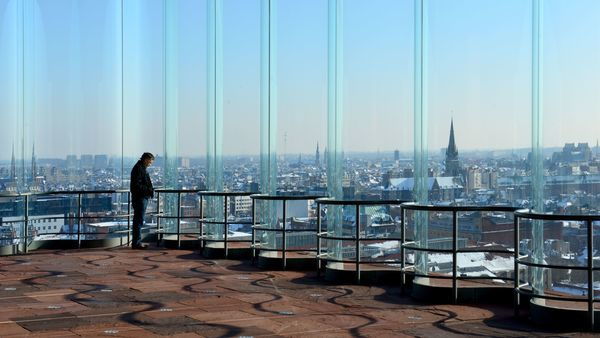 Man enjoys panoramic view of the city from the MAS