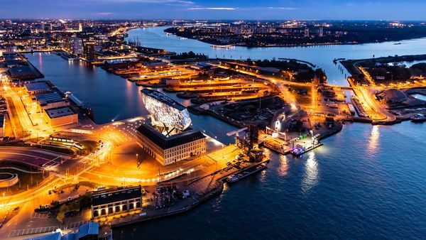 Aerial view of the port, docks, Scheldt and Port House by night.