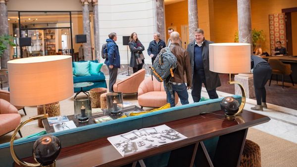 People at the reception desk in a hotel