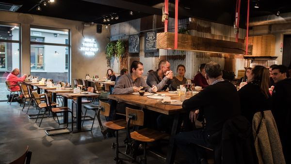Otomat pizzeria filled with customers