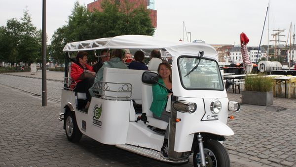Antwerp tuk-tuk drives past the MAS