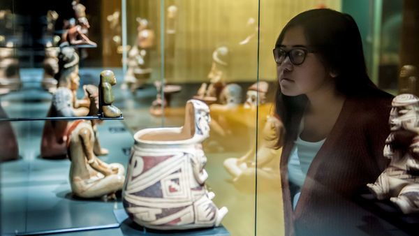 Woman looking at the collection of the MAS museum