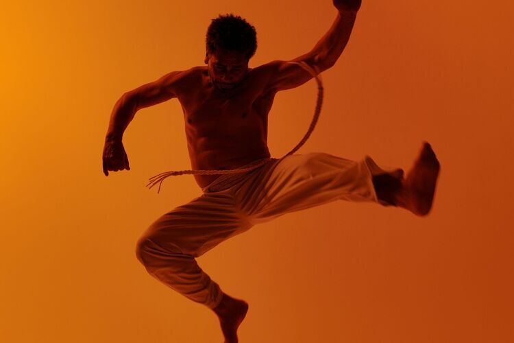 A man jumps into the air.