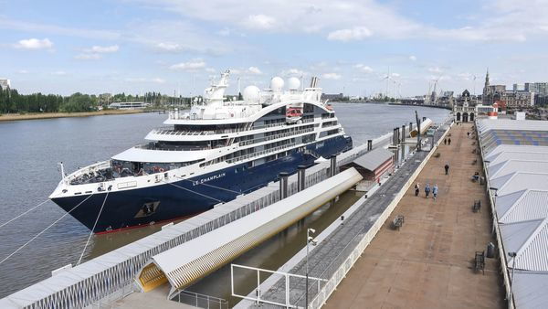 A cruise ship moors at the pontoon in the Historic Centre of Antwerp.
