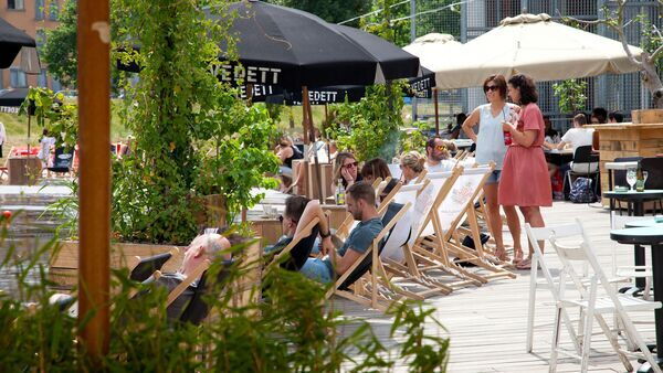 People sitting in beach chairs. 