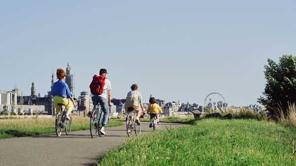 Family on a bike with a beautiful view on the city