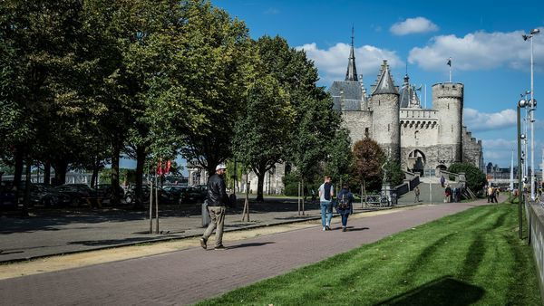 People walking and biking near Het Steen